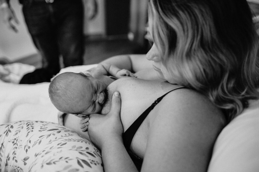 mother breastfeeding newborn baby in hospital after birth 
fresh 48 photography