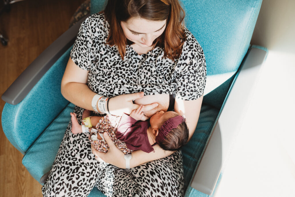 mother breastfeeding newborn baby in hospital after birth 
fresh 48 photography