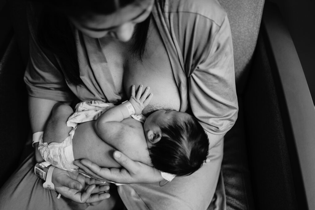 mother holding newborn baby in the hospital, breastfeeding baby
fresh 48 photography