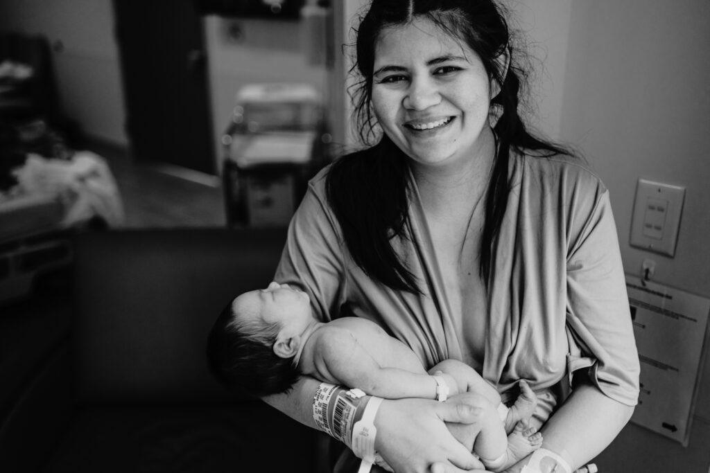 mother holding newborn baby in hospital after birth 
fresh photography