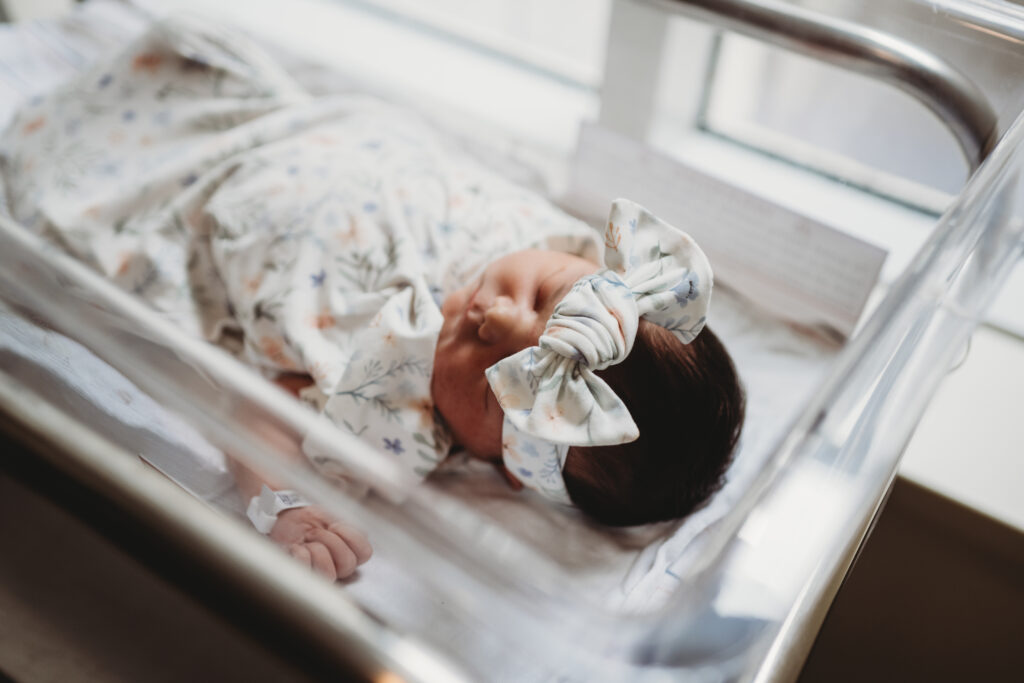 newborn baby laying in bassinet at hospital after birth 
fresh 48 photography