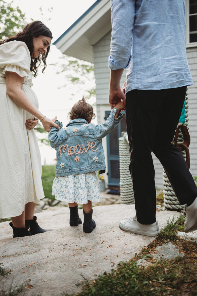 Blue Hill Maine maternity photography showcasing family cottage by the sea