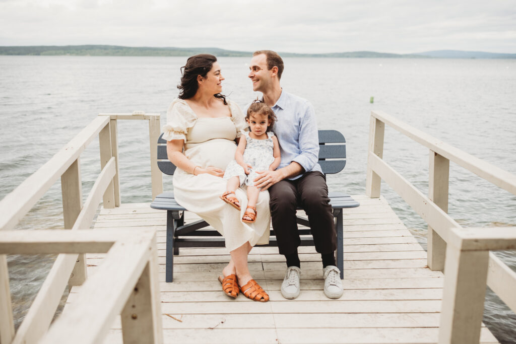 Expecting family photographed by Blue Hill maternity photographer on private dock
