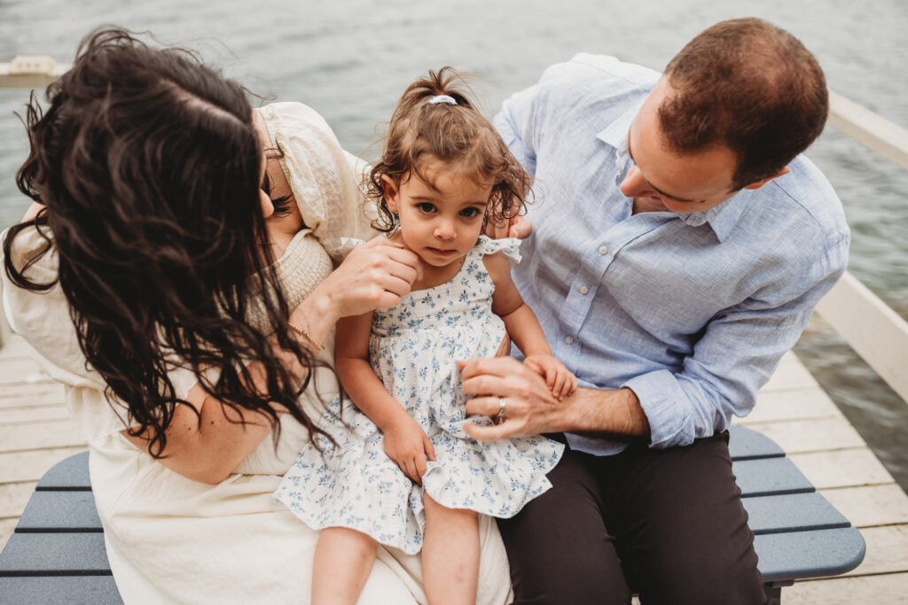 Expecting family photographed by Blue Hill maternity photographer on private dock