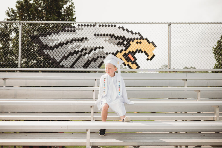 Pre-K graduate wearing cap and gown at Ellsworth Elementary Middle School in Ellsworth Maine
