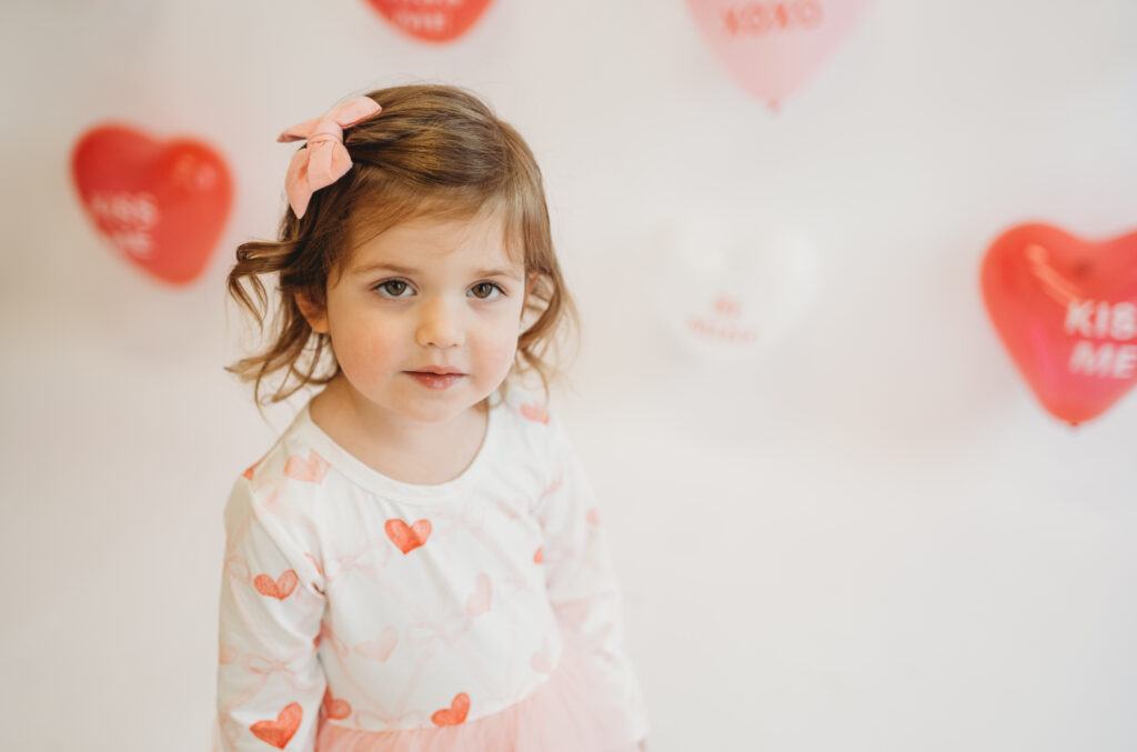 Playful child portrait from Valentine’s Day mini sessions at Selfie Space Studio
