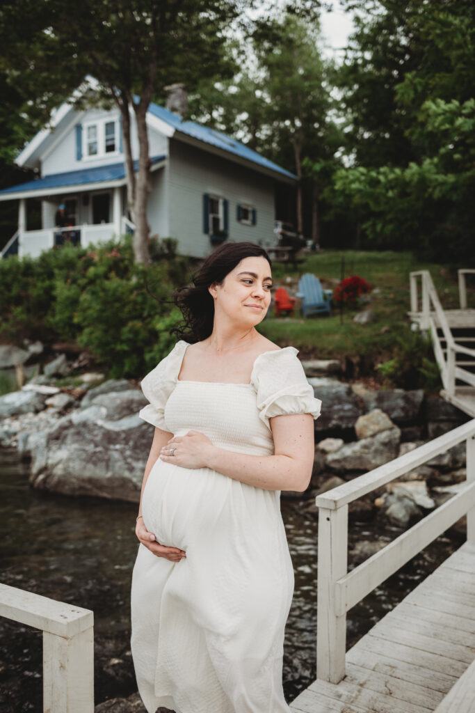 Blue Hill Maine maternity photography showcasing family cottage by the sea