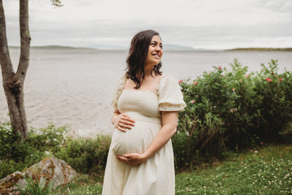 Natural maternity photography in Blue Hill Maine with coastal backdrop